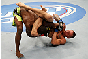 WINNIPEG, CANADA - JUNE 15:  (R-L) Dustin Pague attempts a triangle choke submission against Yves Jabouin in their bantamweight fight during the UFC 161 event at the MTS Centre on June 15, 2013 in Winnipeg, Manitoba, Canada.  (Photo by Josh Hedges/Zuffa LLC/Zuffa LLC via Getty Images)