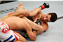WINNIPEG, CANADA - JUNE 15:  (R-L) Roland Delorme elbows Edwin Figueroa in their bantamweight fight during the UFC 161 event at the MTS Centre on June 15, 2013 in Winnipeg, Manitoba, Canada.  (Photo by Josh Hedges/Zuffa LLC/Zuffa LLC via Getty Images)