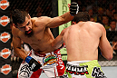 WINNIPEG, CANADA - JUNE 15:  (L-R) Edwin Figueroa punches Roland Delorme in their bantamweight fight during the UFC 161 event at the MTS Centre on June 15, 2013 in Winnipeg, Manitoba, Canada.  (Photo by Josh Hedges/Zuffa LLC/Zuffa LLC via Getty Images)