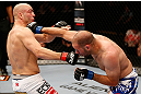 WINNIPEG, CANADA - JUNE 15:  (R-L) Kenny Robertson punches Sean Pierson in their welterweight fight during the UFC 161 event at the MTS Centre on June 15, 2013 in Winnipeg, Manitoba, Canada.  (Photo by Josh Hedges/Zuffa LLC/Zuffa LLC via Getty Images)