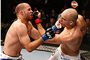 WINNIPEG, CANADA - JUNE 15:  (R-L) Sean Pierson punches Kenny Robertson in their welterweight fight during the UFC 161 event at the MTS Centre on June 15, 2013 in Winnipeg, Manitoba, Canada.  (Photo by Josh Hedges/Zuffa LLC/Zuffa LLC via Getty Images)