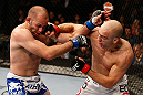 WINNIPEG, CANADA - JUNE 15:  (R-L) Sean Pierson punches Kenny Robertson in their welterweight fight during the UFC 161 event at the MTS Centre on June 15, 2013 in Winnipeg, Manitoba, Canada.  (Photo by Josh Hedges/Zuffa LLC/Zuffa LLC via Getty Images)