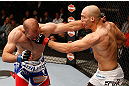 WINNIPEG, CANADA - JUNE 15:  (R-L) Sean Pierson punches Kenny Robertson in their welterweight fight during the UFC 161 event at the MTS Centre on June 15, 2013 in Winnipeg, Manitoba, Canada.  (Photo by Josh Hedges/Zuffa LLC/Zuffa LLC via Getty Images)