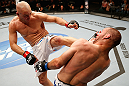 WINNIPEG, CANADA - JUNE 15:  (L-R) Sean Pierson kicks Kenny Robertson in their welterweight fight during the UFC 161 event at the MTS Centre on June 15, 2013 in Winnipeg, Manitoba, Canada.  (Photo by Josh Hedges/Zuffa LLC/Zuffa LLC via Getty Images)