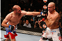 WINNIPEG, CANADA - JUNE 15:  (L-R) Kenny Robertson punches Sean Pierson in their welterweight fight during the UFC 161 event at the MTS Centre on June 15, 2013 in Winnipeg, Manitoba, Canada.  (Photo by Josh Hedges/Zuffa LLC/Zuffa LLC via Getty Images)
