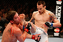 WINNIPEG, CANADA - JUNE 15:  (R-L) James Krause kicks Sam Stout in their lightweight fight during the UFC 161 event at the MTS Centre on June 15, 2013 in Winnipeg, Manitoba, Canada.  (Photo by Josh Hedges/Zuffa LLC/Zuffa LLC via Getty Images)