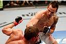 WINNIPEG, CANADA - JUNE 15:  (R-L) James Krause punches Sam Stout in their lightweight fight during the UFC 161 event at the MTS Centre on June 15, 2013 in Winnipeg, Manitoba, Canada.  (Photo by Josh Hedges/Zuffa LLC/Zuffa LLC via Getty Images)