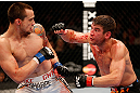 WINNIPEG, CANADA - JUNE 15:  (R-L) Sam Stout punches James Krause in their lightweight fight during the UFC 161 event at the MTS Centre on June 15, 2013 in Winnipeg, Manitoba, Canada.  (Photo by Josh Hedges/Zuffa LLC/Zuffa LLC via Getty Images)