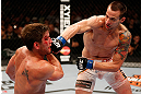 WINNIPEG, CANADA - JUNE 15:  (R-L) James Krause punches Sam Stout in their lightweight fight during the UFC 161 event at the MTS Centre on June 15, 2013 in Winnipeg, Manitoba, Canada.  (Photo by Josh Hedges/Zuffa LLC/Zuffa LLC via Getty Images)