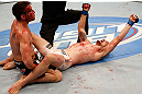 WINNIPEG, CANADA - JUNE 15:  James Krause (R) reacts after his submission victory over Sam Stout (L) in their lightweight fight during the UFC 161 event at the MTS Centre on June 15, 2013 in Winnipeg, Manitoba, Canada.  (Photo by Josh Hedges/Zuffa LLC/Zuffa LLC via Getty Images)