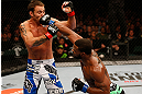 WINNIPEG, CANADA - JUNE 15:  (R-L) Tyron Woodley punches Jake Shields in their welterweight fight during the UFC 161 event at the MTS Centre on June 15, 2013 in Winnipeg, Manitoba, Canada.  (Photo by Josh Hedges/Zuffa LLC/Zuffa LLC via Getty Images)