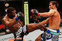 WINNIPEG, CANADA - JUNE 15:  (L-R) Tyron Woodley kicks Jake Shields in their welterweight fight during the UFC 161 event at the MTS Centre on June 15, 2013 in Winnipeg, Manitoba, Canada.  (Photo by Josh Hedges/Zuffa LLC/Zuffa LLC via Getty Images)