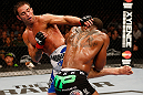 WINNIPEG, CANADA - JUNE 15:  (L-R) Jake Shields kicks Tyron Woodley in their welterweight fight during the UFC 161 event at the MTS Centre on June 15, 2013 in Winnipeg, Manitoba, Canada.  (Photo by Josh Hedges/Zuffa LLC/Zuffa LLC via Getty Images)