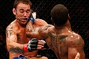 WINNIPEG, CANADA - JUNE 15:  (R-L) Tyron Woodley lands a spinning back fist against Jake Shields in their welterweight fight during the UFC 161 event at the MTS Centre on June 15, 2013 in Winnipeg, Manitoba, Canada.  (Photo by Josh Hedges/Zuffa LLC/Zuffa LLC via Getty Images)