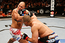 WINNIPEG, CANADA - JUNE 15:  (R-L) Pat Barry punches Shawn Jordan in their heavyweight fight during the UFC 161 event at the MTS Centre on June 15, 2013 in Winnipeg, Manitoba, Canada.  (Photo by Josh Hedges/Zuffa LLC/Zuffa LLC via Getty Images)