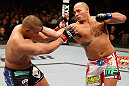 WINNIPEG, CANADA - JUNE 15:  (R-L) Shawn Jordan punches Pat Barry in their heavyweight fight during the UFC 161 event at the MTS Centre on June 15, 2013 in Winnipeg, Manitoba, Canada.  (Photo by Josh Hedges/Zuffa LLC/Zuffa LLC via Getty Images)
