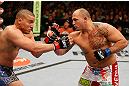 WINNIPEG, CANADA - JUNE 15:  (R-L) Shawn Jordan punches Pat Barry in their heavyweight fight during the UFC 161 event at the MTS Centre on June 15, 2013 in Winnipeg, Manitoba, Canada.  (Photo by Josh Hedges/Zuffa LLC/Zuffa LLC via Getty Images)