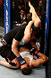 WINNIPEG, CANADA - JUNE 15:  Rosi Sexton (top) punches Alexis Davis as she attempts a triangle choke in their bantamweight fight during the UFC 161 event at the MTS Centre on June 15, 2013 in Winnipeg, Manitoba, Canada.  (Photo by Josh Hedges/Zuffa LLC/Zuffa LLC via Getty Images)