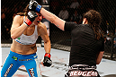 WINNIPEG, CANADA - JUNE 15:  (R-L) Rosi Sexton punches Alexis Davis in their bantamweight fight during the UFC 161 event at the MTS Centre on June 15, 2013 in Winnipeg, Manitoba, Canada.  (Photo by Josh Hedges/Zuffa LLC/Zuffa LLC via Getty Images)