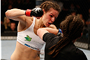 WINNIPEG, CANADA - JUNE 15:  (L-R) Alexis Davis punches Rosi Sexton in their bantamweight fight during the UFC 161 event at the MTS Centre on June 15, 2013 in Winnipeg, Manitoba, Canada.  (Photo by Josh Hedges/Zuffa LLC/Zuffa LLC via Getty Images)