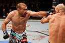 WINNIPEG, CANADA - JUNE 15:  (L-R) Igor Pokrajac punches Ryan Jimmo in their light heavyweight fight during the UFC 161 event at the MTS Centre on June 15, 2013 in Winnipeg, Manitoba, Canada.  (Photo by Josh Hedges/Zuffa LLC/Zuffa LLC via Getty Images)