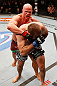 WINNIPEG, CANADA - JUNE 15:  (L-R) Ryan Jimmo punches Igor Pokrajac in their light heavyweight fight during the UFC 161 event at the MTS Centre on June 15, 2013 in Winnipeg, Manitoba, Canada.  (Photo by Josh Hedges/Zuffa LLC/Zuffa LLC via Getty Images)