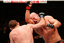 WINNIPEG, CANADA - JUNE 15:  (L-R) Igor Pokrajac punches Ryan Jimmo in their light heavyweight fight during the UFC 161 event at the MTS Centre on June 15, 2013 in Winnipeg, Manitoba, Canada.  (Photo by Josh Hedges/Zuffa LLC/Zuffa LLC via Getty Images)