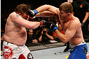 WINNIPEG, CANADA - JUNE 15:  (R-L) Stipe Miocic punches "Big Country" Roy Nelson in their heavyweight fight during the UFC 161 event at the MTS Centre on June 15, 2013 in Winnipeg, Manitoba, Canada.  (Photo by Josh Hedges/Zuffa LLC/Zuffa LLC via Getty Images)