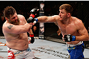 WINNIPEG, CANADA - JUNE 15:  (R-L) Stipe Miocic punches "Big Country" Roy Nelson in their heavyweight fight during the UFC 161 event at the MTS Centre on June 15, 2013 in Winnipeg, Manitoba, Canada.  (Photo by Josh Hedges/Zuffa LLC/Zuffa LLC via Getty Images)
