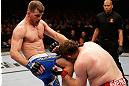 WINNIPEG, CANADA - JUNE 15:  (L-R) Stipe Miocic knees "Big Country" Roy Nelson in their heavyweight fight during the UFC 161 event at the MTS Centre on June 15, 2013 in Winnipeg, Manitoba, Canada.  (Photo by Josh Hedges/Zuffa LLC/Zuffa LLC via Getty Images)