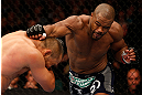 WINNIPEG, CANADA - JUNE 15:  (R-L) Rashad Evans punches Dan Henderson in their light heavyweight fight during the UFC 161 event at the MTS Centre on June 15, 2013 in Winnipeg, Manitoba, Canada.  (Photo by Josh Hedges/Zuffa LLC/Zuffa LLC via Getty Images)