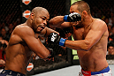 WINNIPEG, CANADA - JUNE 15:  (R-L) Dan Henderson punches Rashad Evans in their light heavyweight fight during the UFC 161 event at the MTS Centre on June 15, 2013 in Winnipeg, Manitoba, Canada.  (Photo by Josh Hedges/Zuffa LLC/Zuffa LLC via Getty Images)
