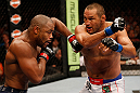 WINNIPEG, CANADA - JUNE 15:  (R-L) Dan Henderson punches Rashad Evans in their light heavyweight fight during the UFC 161 event at the MTS Centre on June 15, 2013 in Winnipeg, Manitoba, Canada.  (Photo by Josh Hedges/Zuffa LLC/Zuffa LLC via Getty Images)