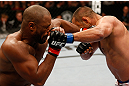 WINNIPEG, CANADA - JUNE 15:  (R-L) Dan Henderson and Rashad Evans trade punches in their light heavyweight fight during the UFC 161 event at the MTS Centre on June 15, 2013 in Winnipeg, Manitoba, Canada.  (Photo by Josh Hedges/Zuffa LLC/Zuffa LLC via Getty Images)