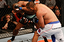 WINNIPEG, CANADA - JUNE 15:  (R-L) Dan Henderson punches Rashad Evans in their light heavyweight fight during the UFC 161 event at the MTS Centre on June 15, 2013 in Winnipeg, Manitoba, Canada.  (Photo by Josh Hedges/Zuffa LLC/Zuffa LLC via Getty Images)