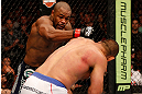 WINNIPEG, CANADA - JUNE 15:  (L-R) Rashad Evans punches Dan Henderson in their light heavyweight fight during the UFC 161 event at the MTS Centre on June 15, 2013 in Winnipeg, Manitoba, Canada.  (Photo by Josh Hedges/Zuffa LLC/Zuffa LLC via Getty Images)