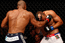 WINNIPEG, CANADA - JUNE 15:  (L-R) Rashad Evans punches Dan Henderson in their light heavyweight fight during the UFC 161 event at the MTS Centre on June 15, 2013 in Winnipeg, Manitoba, Canada.  (Photo by Josh Hedges/Zuffa LLC/Zuffa LLC via Getty Images)