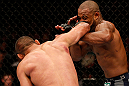 WINNIPEG, CANADA - JUNE 15:  (L-R) Dan Henderson punches Rashad Evans in their light heavyweight fight during the UFC 161 event at the MTS Centre on June 15, 2013 in Winnipeg, Manitoba, Canada.  (Photo by Josh Hedges/Zuffa LLC/Zuffa LLC via Getty Images)