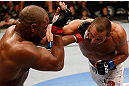 WINNIPEG, CANADA - JUNE 15:  (R-L) Dan Henderson punches Rashad Evans in their light heavyweight fight during the UFC 161 event at the MTS Centre on June 15, 2013 in Winnipeg, Manitoba, Canada.  (Photo by Josh Hedges/Zuffa LLC/Zuffa LLC via Getty Images)
