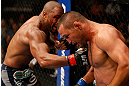 WINNIPEG, CANADA - JUNE 15:  (L-R) Rashad Evans punches Dan Henderson in their light heavyweight fight during the UFC 161 event at the MTS Centre on June 15, 2013 in Winnipeg, Manitoba, Canada.  (Photo by Josh Hedges/Zuffa LLC/Zuffa LLC via Getty Images)