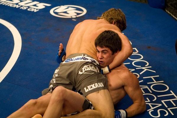 Urijah Faber (top) submits Dominick Cruz in their first meeting at WEC 26 to retain the WEC featherweight title.
