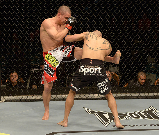 LAS VEGAS, NV - DECEMBER 29:  (L-R) Chris Cariaso kicks John Moraga during their flyweight fight at UFC 155 on December 29, 2012 at MGM Grand Garden Arena in Las Vegas, Nevada. (Photo by Donald Miralle/Zuffa LLC/Zuffa LLC via Getty Images) *** Local Caption *** Chris Cariaso; John Moraga