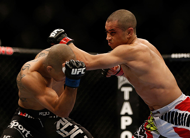 LAS VEGAS, NV - DECEMBER 29:  (R-L) Chris Cariaso punches John Moraga during their flyweight fight at UFC 155 on December 29, 2012 at MGM Grand Garden Arena in Las Vegas, Nevada. (Photo by Josh Hedges/Zuffa LLC/Zuffa LLC via Getty Images) *** Local Caption *** Chris Cariaso; John Moraga
