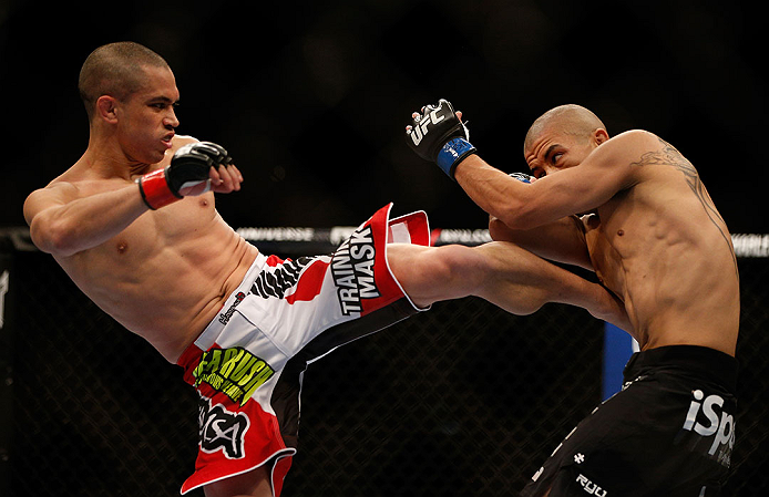 LAS VEGAS, NV - DECEMBER 29:  (L-R) Chris Cariaso kicks John Moraga during their flyweight fight at UFC 155 on December 29, 2012 at MGM Grand Garden Arena in Las Vegas, Nevada. (Photo by Josh Hedges/Zuffa LLC/Zuffa LLC via Getty Images) *** Local Caption *** Chris Cariaso; John Moraga