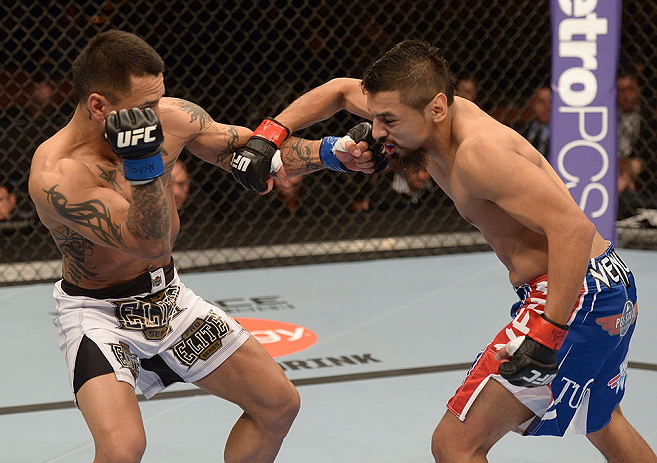 LAS VEGAS, NV - FEBRUARY 02: (R-L) Edwin Figueroa punches Francisco Rivera during their bantamweight fight at UFC 156 on February 2, 2013 at the Mandalay Bay Events Center in Las Vegas, Nevada. (Photo by Donald Miralle/Zuffa LLC/Zuffa LLC via Getty Images) *** Local Caption *** Francisco Rivera; Edwin Figueroa