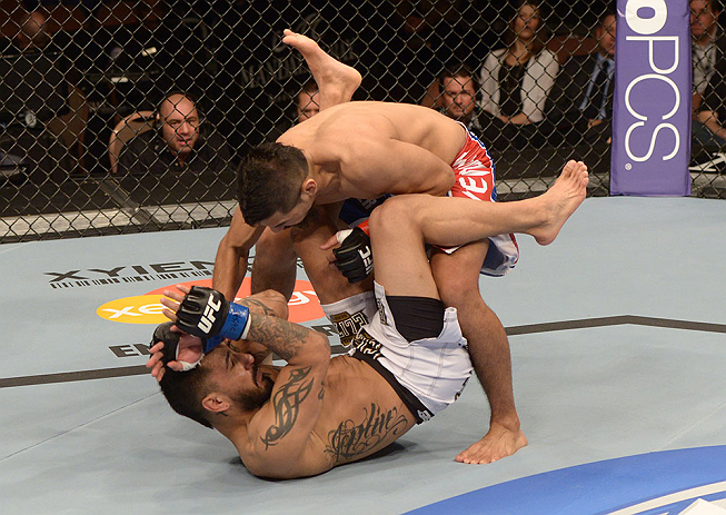 LAS VEGAS, NV - FEBRUARY 02: Edwin Figueroa (top) punches Francisco Rivera during their bantamweight fight at UFC 156 on February 2, 2013 at the Mandalay Bay Events Center in Las Vegas, Nevada. (Photo by Donald Miralle/Zuffa LLC/Zuffa LLC via Getty Images) *** Local Caption *** Francisco Rivera; Edwin Figueroa