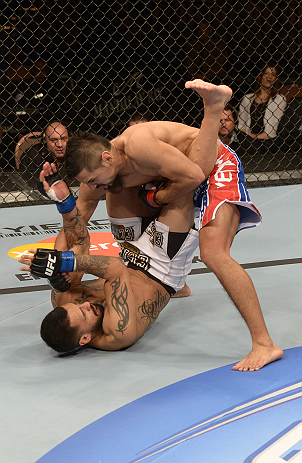LAS VEGAS, NV - FEBRUARY 02: Edwin Figueroa (top) punches Francisco Rivera during their bantamweight fight at UFC 156 on February 2, 2013 at the Mandalay Bay Events Center in Las Vegas, Nevada. (Photo by Donald Miralle/Zuffa LLC/Zuffa LLC via Getty Images) *** Local Caption *** Francisco Rivera; Edwin Figueroa