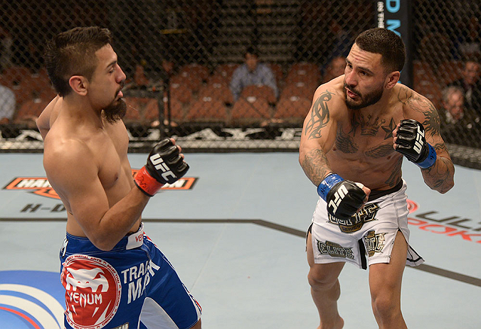 LAS VEGAS, NV - FEBRUARY 02: (R-L) Francisco Rivera punches Edwin Figueroa during their bantamweight fight at UFC 156 on February 2, 2013 at the Mandalay Bay Events Center in Las Vegas, Nevada. (Photo by Donald Miralle/Zuffa LLC/Zuffa LLC via Getty Images) *** Local Caption *** Francisco Rivera; Edwin Figueroa