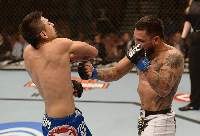 LAS VEGAS, NV - FEBRUARY 02: (R-L) Francisco Rivera punches Edwin Figueroa during their bantamweight fight at UFC 156 on February 2, 2013 at the Mandalay Bay Events Center in Las Vegas, Nevada. (Photo by Donald Miralle/Zuffa LLC/Zuffa LLC via Getty Images) *** Local Caption *** Francisco Rivera; Edwin Figueroa