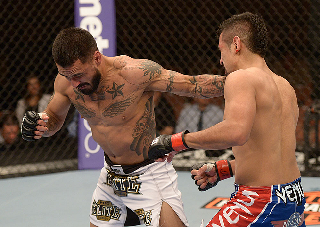 LAS VEGAS, NV - FEBRUARY 02: (L-R) Francisco Rivera punches Edwin Figueroa during their bantamweight fight at UFC 156 on February 2, 2013 at the Mandalay Bay Events Center in Las Vegas, Nevada. (Photo by Donald Miralle/Zuffa LLC/Zuffa LLC via Getty Images) *** Local Caption *** Francisco Rivera; Edwin Figueroa